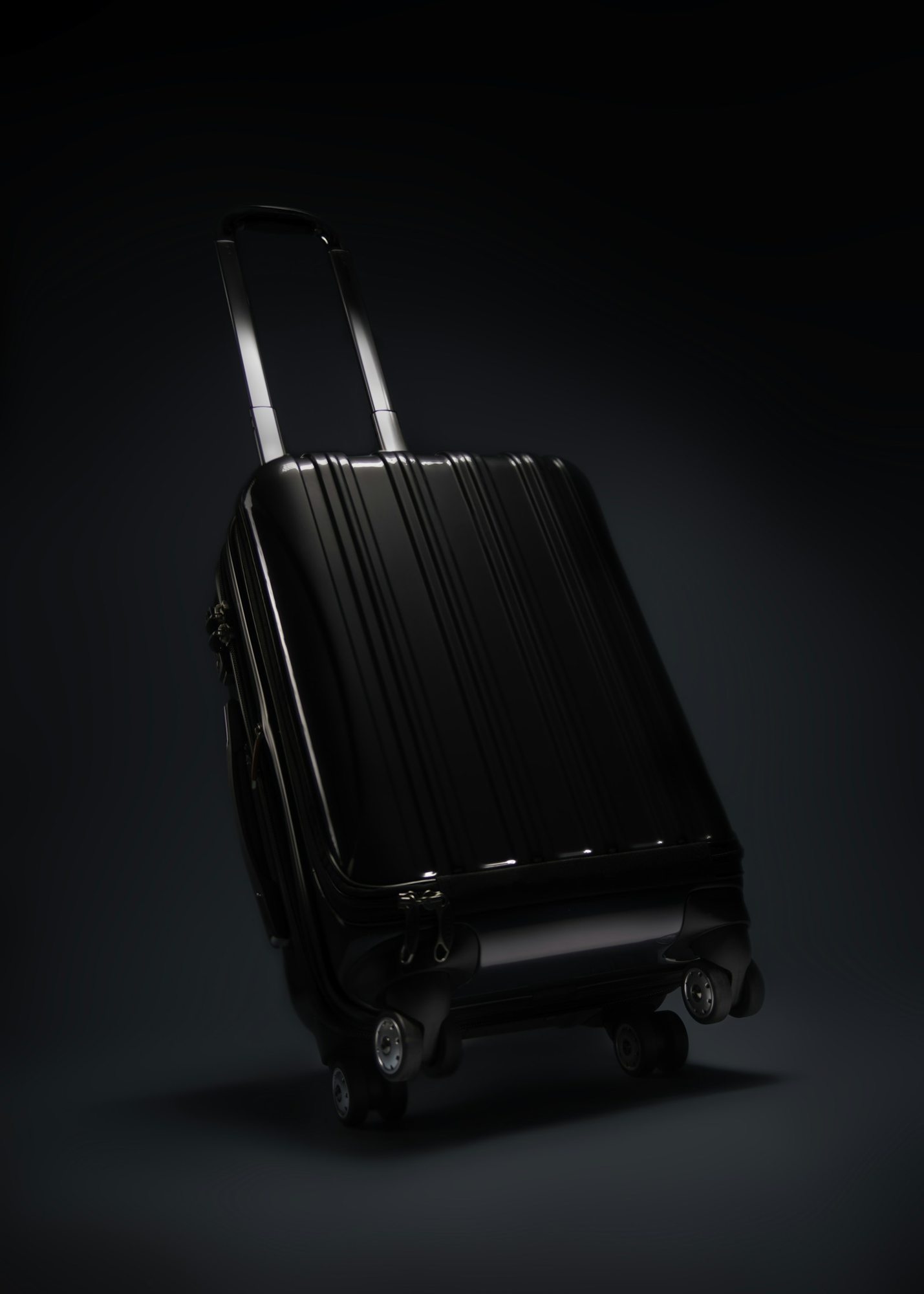 Black rolling suitcase with a rigid shell